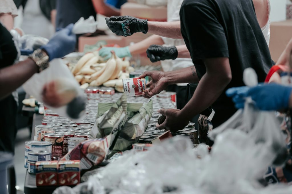 charity workers handing out food supplies